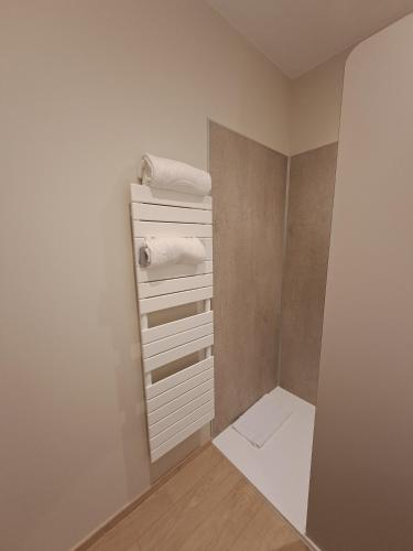 a bathroom with white towels and a mirror at KYRIAD PRESTIGE - PIERRELATTE in Pierrelatte