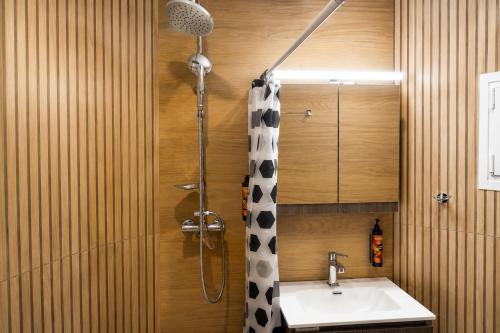 a bathroom with a shower and a sink at Karies House in Kefalos
