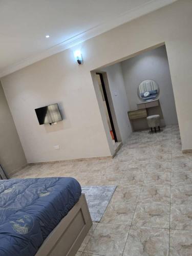 a bedroom with a bed and a fireplace in it at Luxury Home Away in Aja