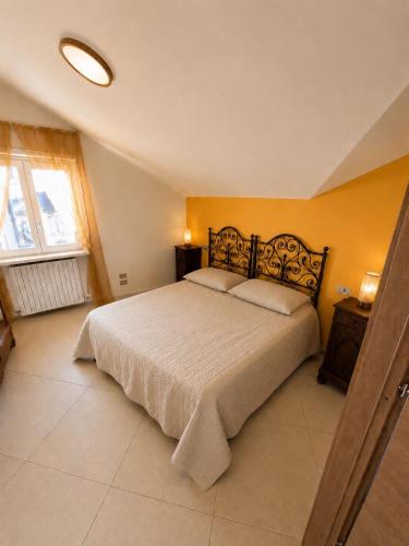 a bedroom with a large bed in a room at il canto del lago in Iseo