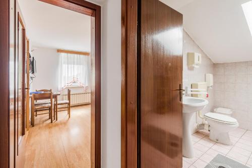 a bathroom with a toilet and a sink at Turistična kmetija Široko in Tolmin