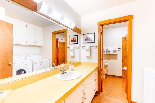 a bathroom with a sink and a mirror at 3223 Thimbleberry in Wilson