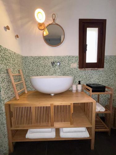 a bathroom with a white sink and a mirror at Sale34 in Marsala