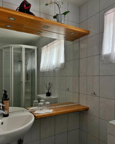 a bathroom with a sink and a mirror at Engimyri Lodge in Akureyri