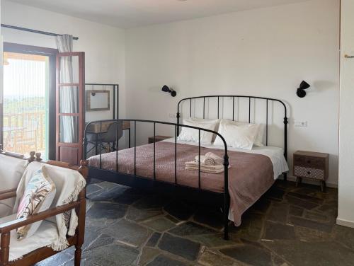 a bedroom with a bed and a window at Asteri Living in Alonnisos