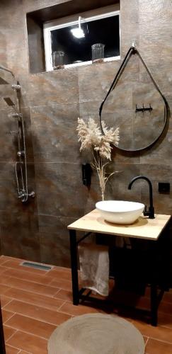 a bathroom with a sink and a shower at Near Yerevan Serlinhouse in Oshakan