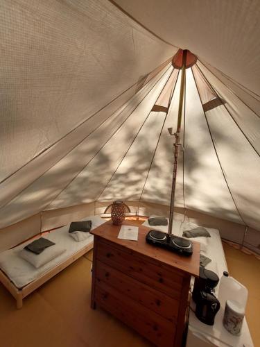 a bedroom with a bed in a tent at Glamping Tolvsbo Inn in Söderbärke