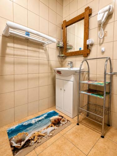 a bathroom with a floor that has a cow on it at Noclegi u Marka in Czernichów