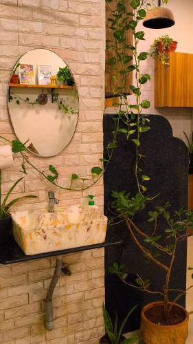 a bathroom with a sink and a mirror at The Culture House in Mumbai