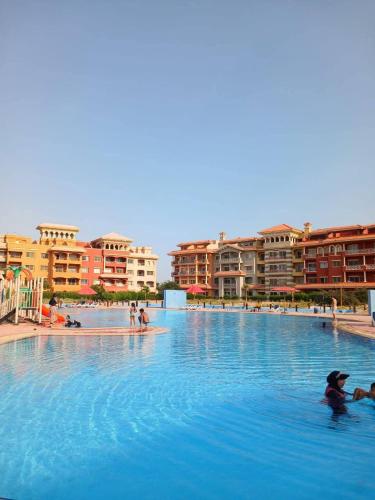 a large swimming pool with people in the water at Chalet in sharm el shekh in Sharm El Sheikh