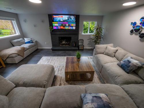 a living room with two couches and a fireplace at Remodeled 2BR, Chic and Cozy in Shoreline