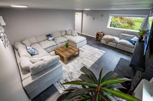 a living room with a couch and a table at Remodeled 2BR, Chic and Cozy in Shoreline