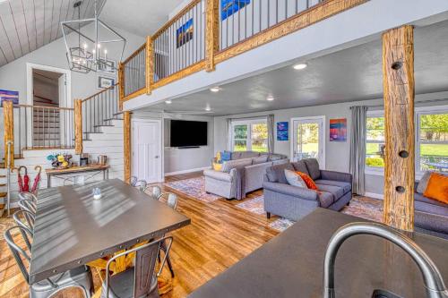 a kitchen and living room with a table and chairs at Westeros by Simple Life Rentals in Ephraim