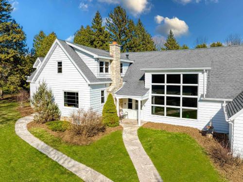 a white house with a driveway at Westeros by Simple Life Rentals in Ephraim
