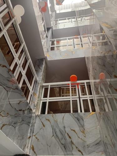 an empty room with white walls and marble floors at HOTEL DU PRINCE Bingerville in Bingerville