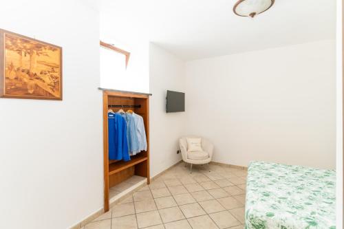 a room with a closet and a toilet in it at GrandPa's House in Sorrento
