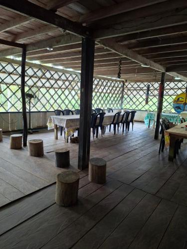 a group of tables and chairs in a pavilion at Macedonia Lodge in Macedonia