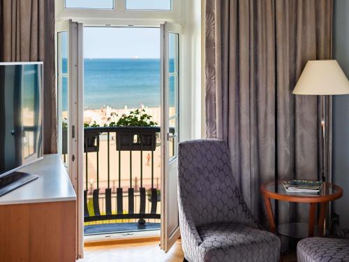 a room with a room with a view of the ocean at Sofitel Grand Sopot in Sopot
