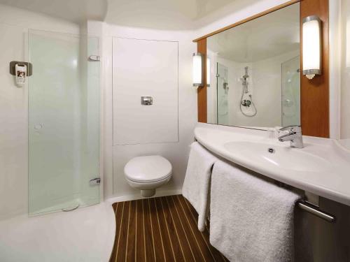a bathroom with a toilet and a sink and a shower at ibis Aberdeen Centre – Quayside in Aberdeen