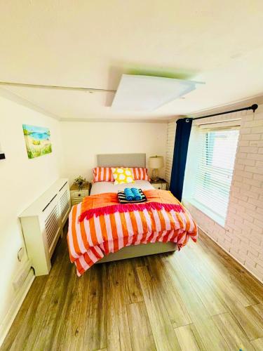 a bedroom with a bed and a window at 4 Market Street in Bantry