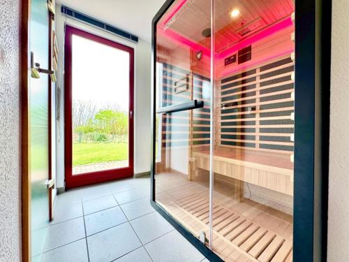 a walk in shower with a glass door at Seestrasse 35 in Insel Poel