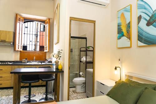 a small bathroom with a sink and a toilet at Casa del Patio in Guadalajara