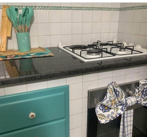 a kitchen counter with a stove top oven at Appartamento ANGIE in Forio d'Ischia