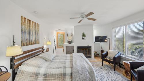 a bedroom with a bed and a living room at Sleeping Bear by AvantStay in North Creek