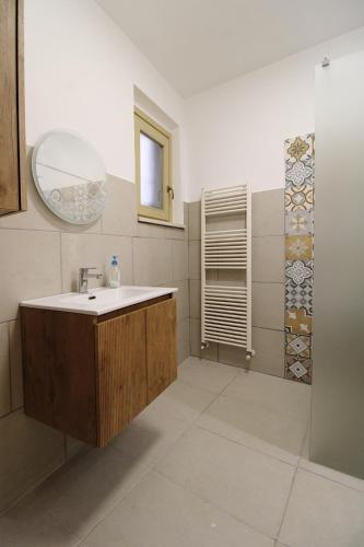 a bathroom with a sink and a mirror at Casa Conti Trivelli 2 in Vasto