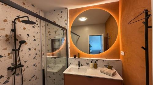 a bathroom with a sink and a mirror at Bela Bonita in Spišská Belá