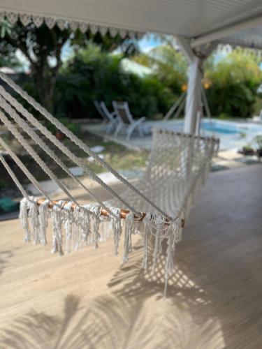 a white bench with icicles hanging from it at Villa Odeyssia in Sainte-Anne