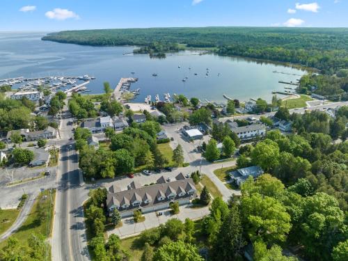 an aerial view of a town with a lake at Bluff Haven by Simple Life Rentals in Fish Creek