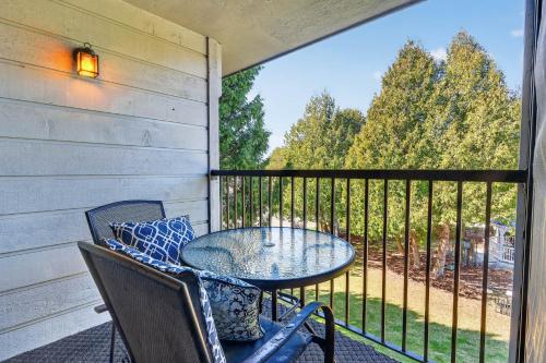 a patio with a table and chairs on a balcony at Cedar Haven Unit 202 by Simple Life Rentals in Ephraim