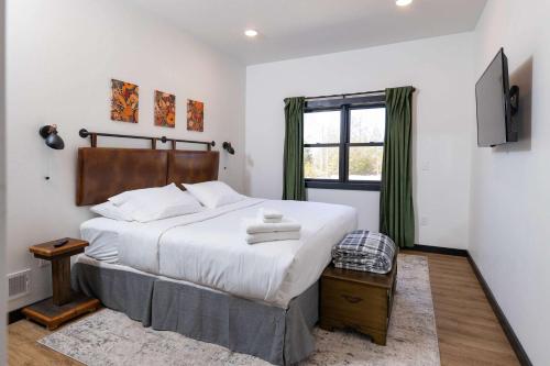 a bedroom with a large bed and a window at Flint Ridge in Sister Bay