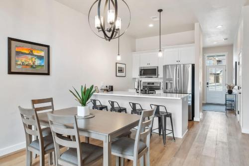 a kitchen and dining room with a table and chairs at La Dolce Vita in Egg Harbor