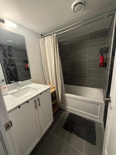 a bathroom with a sink and a shower at Oakville Townhouse Amazing Rooftop in Oakville