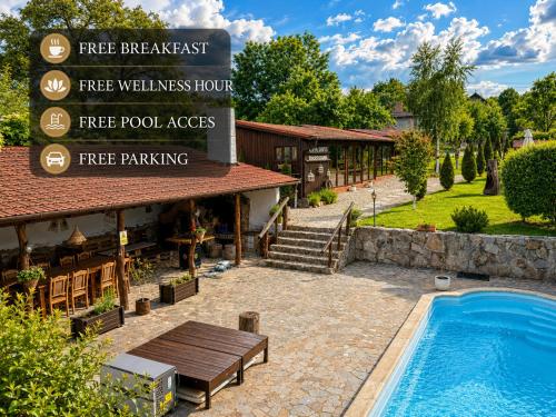 a hotel with a swimming pool in front of a building at Casa Dives - Varianta Boierească in Pianu de Sus