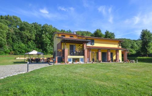a large house with a lawn in front of it at Beautiful Home In Arezzo in Arezzo