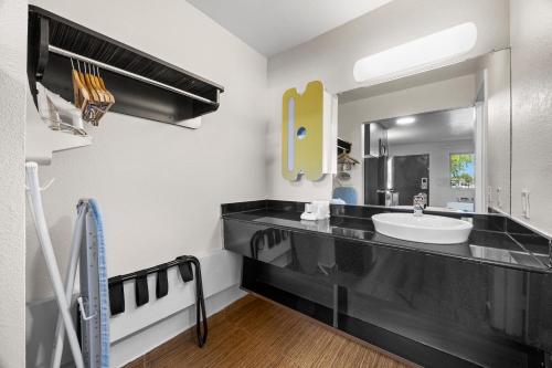 a bathroom with a sink and a mirror at Studio 6-Fairfield, CA - Napa Valley in Fairfield