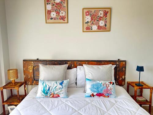 a bedroom with a bed with two pillows on it at TRA CIELO e MARE da VALE in Fano