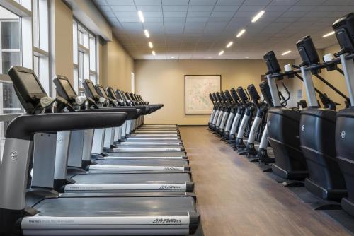 a gym with rows of tread machines at Hyatt Regency Orlando in Orlando