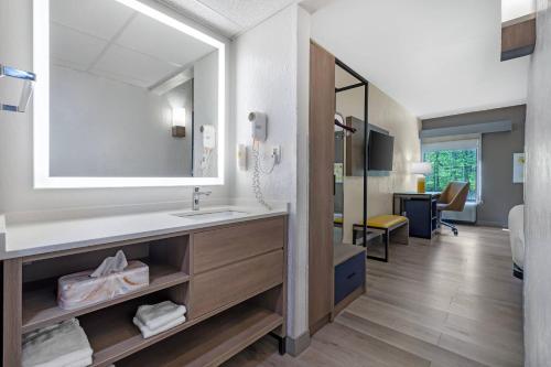 a bathroom with a sink and a mirror at Comfort Inn West Hazleton in West Hazleton