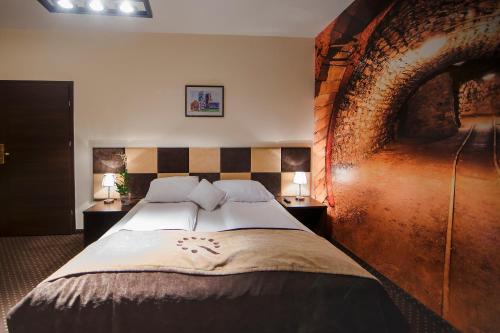 Posteľ alebo postele v izbe v ubytovaní Boutique Hotel's Bytom
