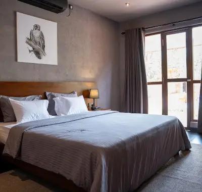 a bedroom with a large bed and a window at Viento - Habarana in Habarana