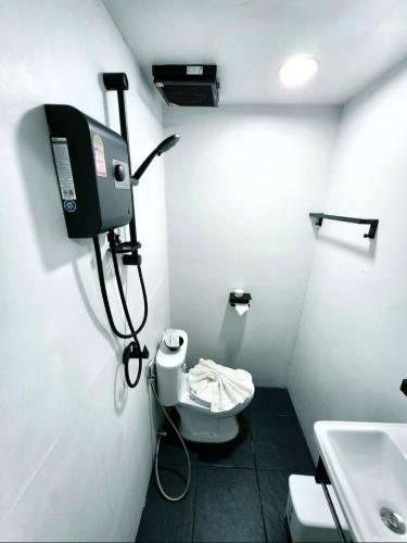 a small bathroom with a toilet and a sink at Cloud Bed Ao Nang- High Speed internet, Comfort bed , Smart Tv in Ao Nang Beach
