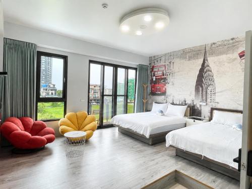 a bedroom with two beds and a large window at Blue Sea and Sunny B&B in Toucheng