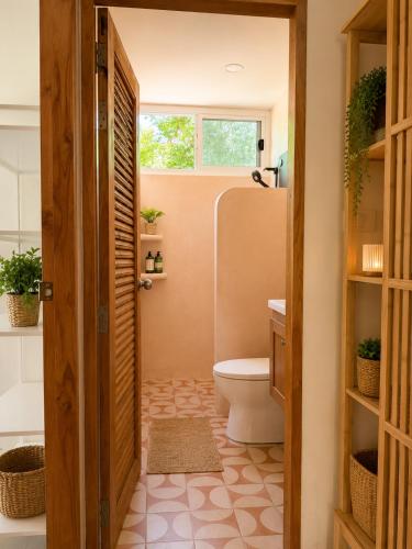 a bathroom with a toilet and a sink at Phangan Chalet Bungalows in Chaloklum