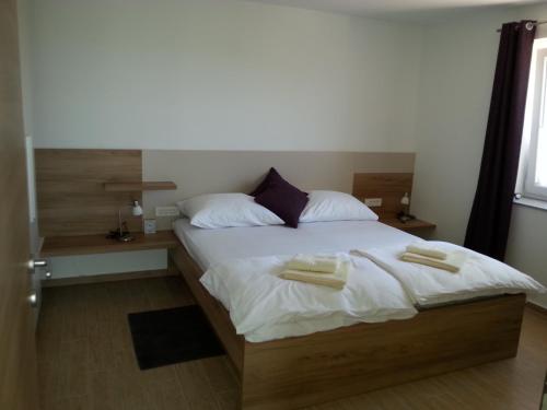 Postel nebo postele na pokoji v ubytování Summer Delight Apartments