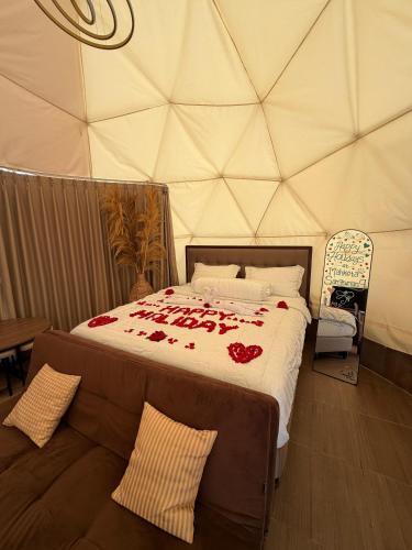 a bedroom with a bed in a tent at Glamping Grand Mazaya Private Pool in Bandung