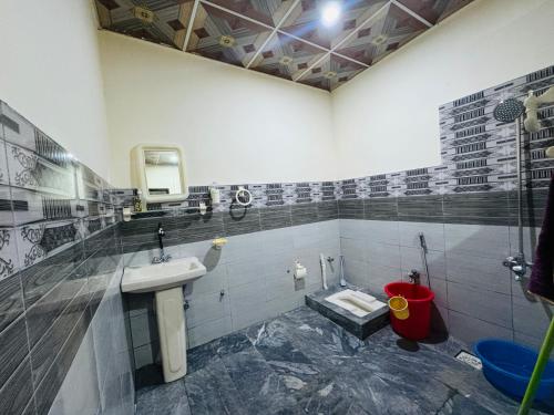 a bathroom with a sink and a toilet at Valley View Homestay in Bīrgal